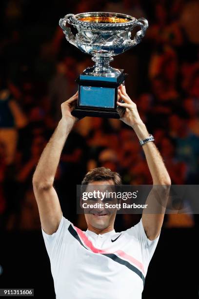 Roger Federer of Switzerland poses with the Norman Brookes Challenge Cup after winning the 2018 Australian Open Men's Singles Final against Marin...