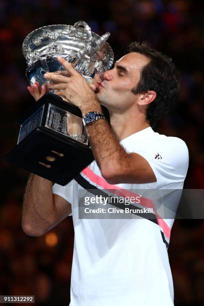 Roger Federer of Switzerland kisses the Norman Brookes Challenge Cup after winning the 2018 Australian Open Men's Singles Final against Marin Cilic...