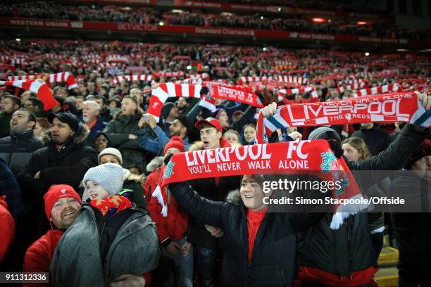 Liverpool fans hold their scarves aloft as they sing 'You'll Never Walk Alone' before The Emirates FA Cup Fourth Round match between Liverpool and...