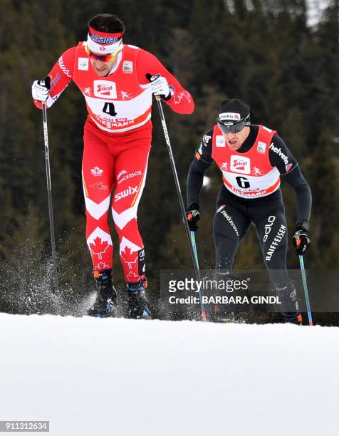 Alex Harvey of Canada and Dario Cologna of Switzerland compete in the Mens FIS Cross Country 15 km Mass Start World Cup on January 28, 2018 in...