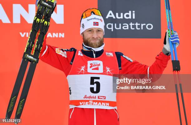 Martin Johnsrud Sundby of Norway celebrates on the podium after finishing third in the Mens FIS Cross Country 15 km Mass Start World Cup on January...