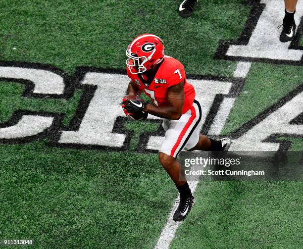Andre Swift of the Georgia Bulldogs carries the ball against the Alabama Crimson Tide in the CFP National Championship presented by AT&T at...