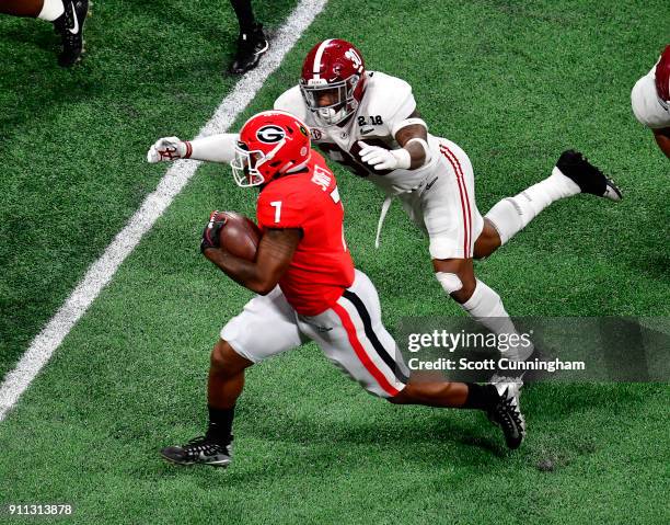 Andre Swift of the Georgia Bulldogs carries the ball against the Alabama Crimson Tide in the CFP National Championship presented by AT&T at...