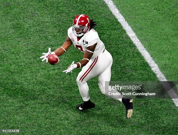 Bo Scarbrough of the Alabama Crimson Tide makes a catch against the Georgia Bulldogs in the CFP National Championship presented by AT&T at...
