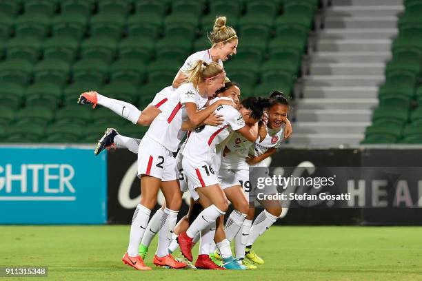 Rachel Lowe of the Wanderers is congratulated by team mates after scoring during the round 13 W-League match between the Perth Glory and the Western...