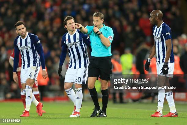 Referee Craig Pawson points to award a penalty following a decision to refer to the Video Assistant Referee system as Hal Robson-Kanu of West Brom ,...