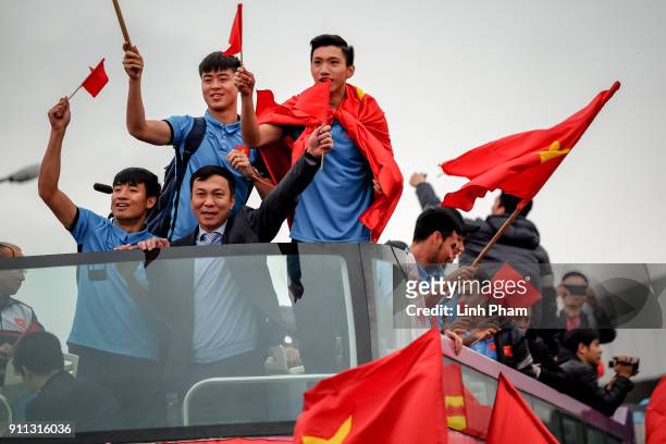 Members of U-23 Vietnam football team greet fans in front of Noi Bai Airport after returning from 2018 Asian Football Confederation's championship on...