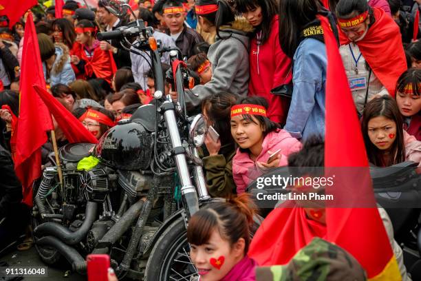 Thousands of Vietnamese soccer fans pour into Hanoi's city center to celebrate U-23 Vietnam's silver medals at the Asian Football Confederation's...