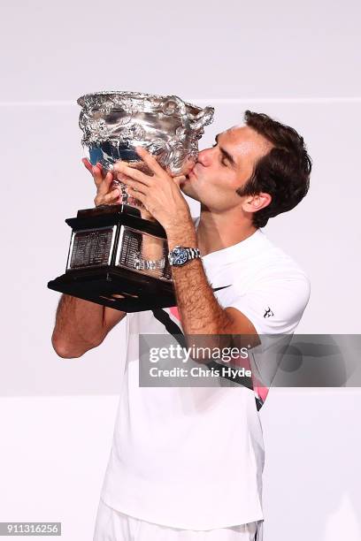 Roger Federer of Switzerland kisses the Norman Brookes Challenge Cup after winning the 2018 Australian Open Men's Singles Final against Marin Cilic...