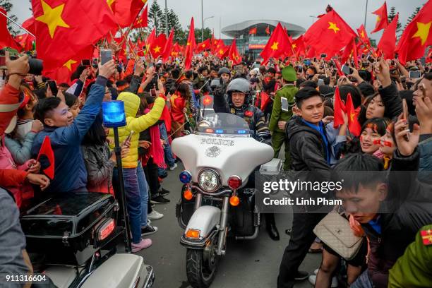 Thousands of Vietnamese soccer fans pour into Hanoi's city center to celebrate U-23 Vietnam's silver medals at the Asian Football Confederation's...