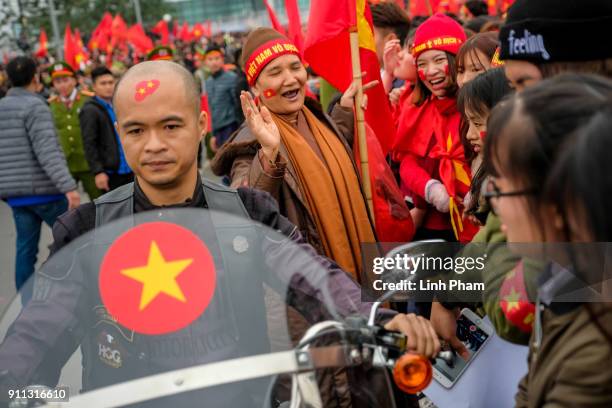 Thousands of Vietnamese soccer fans pour into Hanoi's city center to celebrate U-23 Vietnam's silver medals at the Asian Football Confederation's...