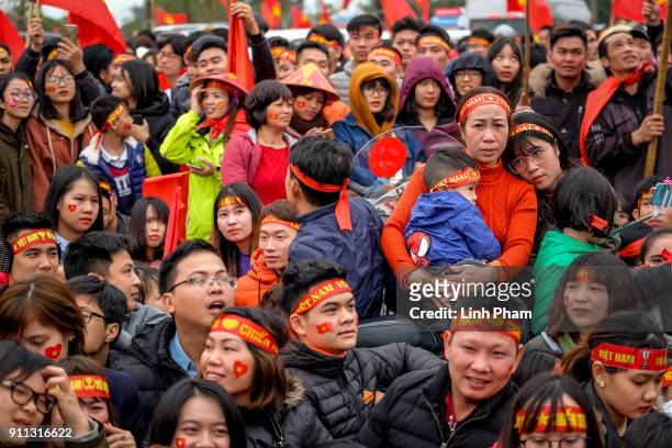Thousands of Vietnamese soccer fans pour into Hanoi's city center to celebrate U-23 Vietnam's silver medals at the Asian Football Confederation's...