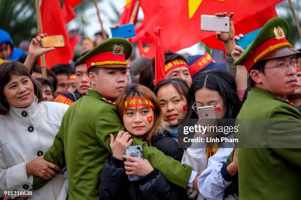 Thousands of Vietnamese soccer fans pour into Hanoi's city center to celebrate U-23 Vietnam's silver medals at the Asian Football Confederation's...