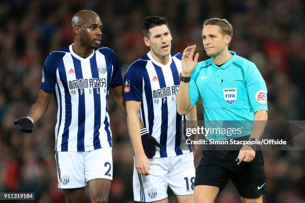 Allan-Romeo Nyom of West Brom and Gareth Barry of West Brom react after referee Craig Pawson awarded a penalty following a decision to refer to the...