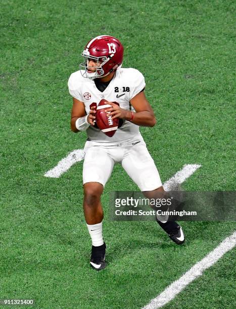 Tua Tagovailoa of the Alabama Crimson Tide passes against the Georgia Bulldogs in the CFP National Championship presented by AT&T at Mercedes-Benz...
