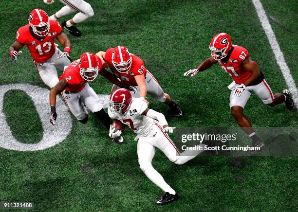 Trevon Diggs of the Alabama Crimson Tide carries the ball against Richard Lecounte, Trent Frix, Jonathan Ledbetter, and Miles McGinty of the Georgia...