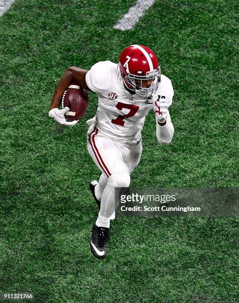 Trevon Diggs of the Alabama Crimson Tide carries the ball against the Georgia Bulldogs in the CFP National Championship presented by AT&T at...