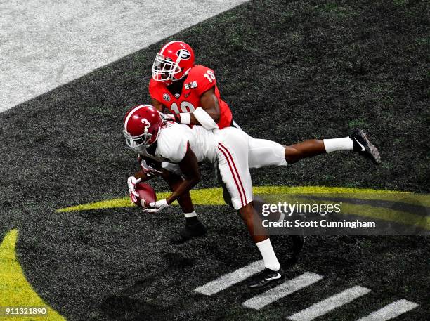 Calvin Ridley of the Alabama Crimson Tide is unable to make a catch in the end zone against Deandre Baker of the Georgia Bulldogs in the CFP National...