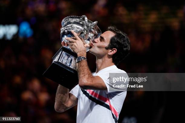 Roger Federer of Switzerland kisses the Norman Brookes Challenge Cup after winning the 2018 Australian Open Men's Singles Final against Marin Cilic...