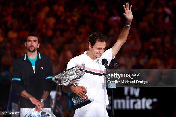 An emotional Roger Federer of Switzerland speaks on stage with the Norman Brookes Challenge Cup after winning the 2018 Australian Open Men's Singles...