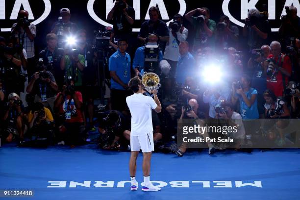 Roger Federer of Switzerland celebrates victory in the mens final against Marin Cilic of Croatia on day 14 of the 2018 Australian Open at Melbourne...