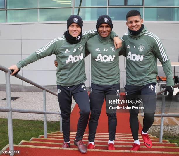 Ander Herrera, Antonio Valencia and Marcos Rojo of Manchester United in action during a first team training session at Aon Training Complex on...