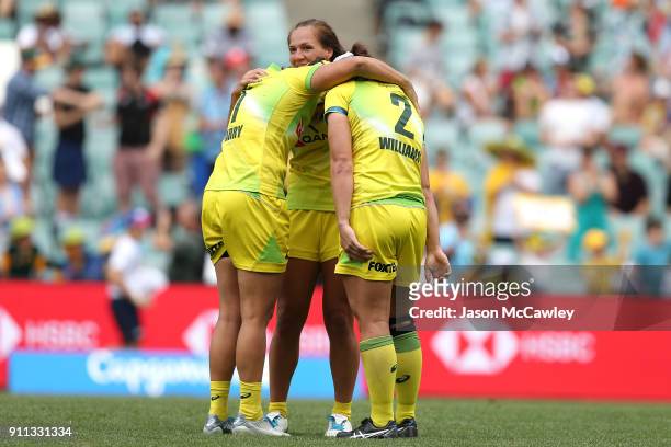 Sharni Williams, Shannon Parry and Evania Pelite of Australia celebrate victory at the end of final match against New Zealand during day three of the...
