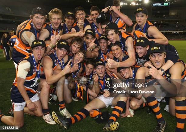 Calder Cannon players celebrate winning he premiership after the TAC Cup Grand Final match between the Dandenong Stingrays and the Calder Canons at...