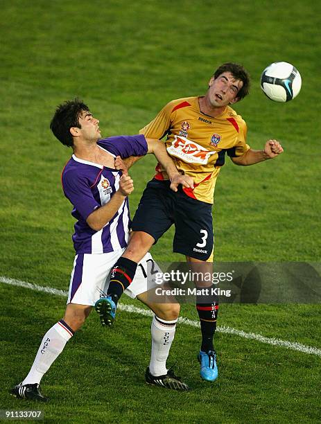 Mario Simic of the Jets and Reece Vittiglia of the Glory challenge for a header during the round three National Youth League match between the...