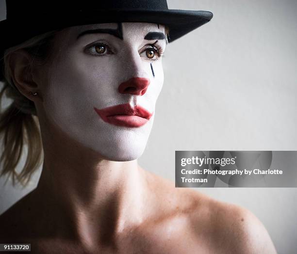 woman in a top hat face painted as a pierot clown - sad clown stock pictures, royalty-free photos & images