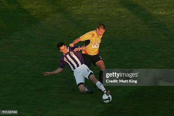 Mirjan Pavlovic of the Jets and Steven Hesketh of the Glory challenge for the ball during the round three National Youth League match between the...