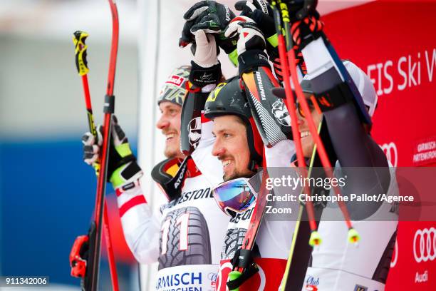 Manuel Feller of Austria takes 2nd place, Marcel Hirscher of Austria takes 1st place, Ted Ligety of USA takes 3rd place during the Audi FIS Alpine...