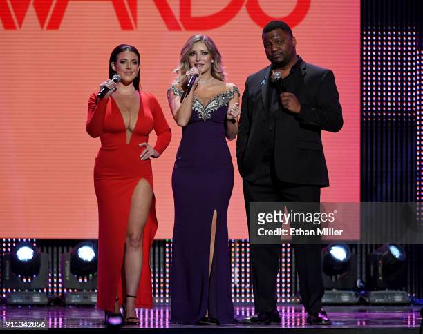 Adult film actress/director Angela White, webcam model Harli Lotts and actor/comedian Aries Spears co-host the 2018 Adult Video News Awards at The...