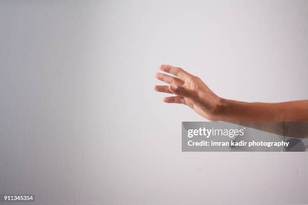 photo for body part hand - man holding his hand out stock pictures, royalty-free photos & images