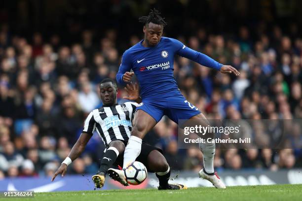 Henri Saivet of Newcastle United tackles Michy Batshuayi of Chelsea during The Emirates FA Cup Fourth Round match between Chelsea and Newcastle on...