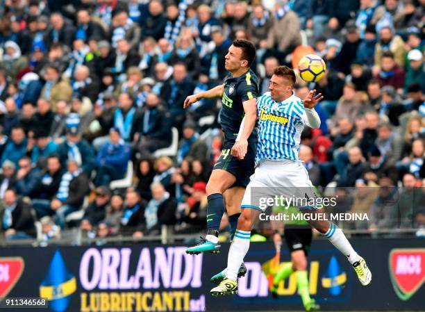 Spal's Italian midfielder Mariano Arini fights for the ball with Inter Milan's Croatian forward Ivan Perisic during the Italian Serie A football...