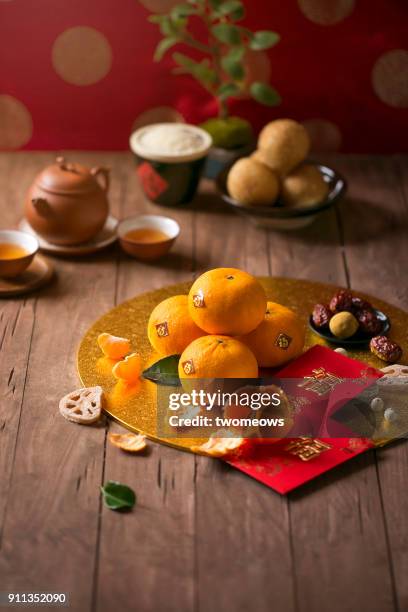chinese new year food and drink still life. selective focus image. - lunar new year cup 2017 stock-fotos und bilder