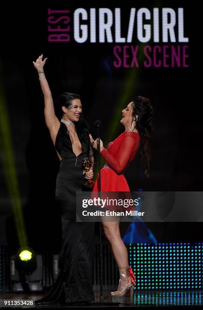 Adult film actresses Katrina Jade and Kissa Sins react after winning the award for Best Girl/Girl Sex Scene during the 2018 Adult Video News Awards...