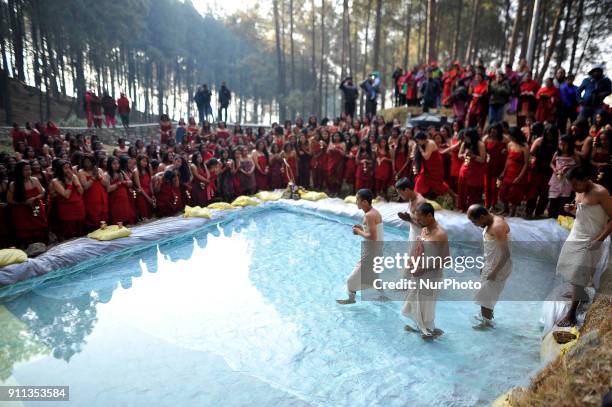 Nepalese Hindu carries the idol Madhav Narayan for ritual holy Bath at premises of Changu Narayan Temple, Bhaktapur during Madhav Narayan Festival or...