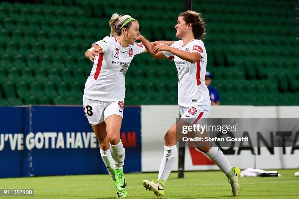 Rachel Lowe congratulates Erica Halloway of the Wanderers after scoring during the round 13 W-League match between the Perth Glory and the Western...