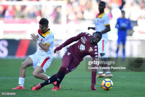 Baye Niang of Torino FC is challenged by Danilo Cataldi of Benevento Calcio during the Serie A match between Torino FC and Benevento Calcio at Stadio...