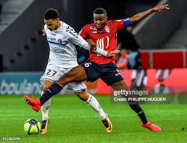 Strasbourg's French defender Kenny Lala vies with Lille's French midefielder Ibrahim Amadou during the French L1 football match between Lille and...