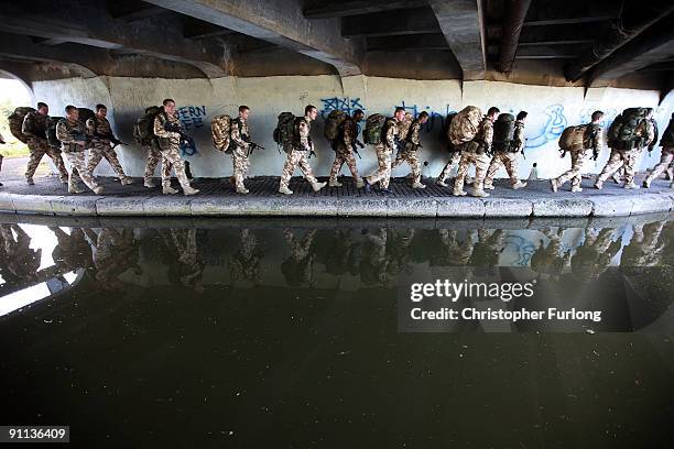 Soldiers of 1st Battalion The Royal Welsh walk along a countryside canal on their way to Chester to say farewell to the city before deploying on...