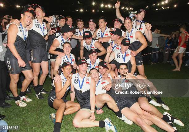 The North Ballarat players celebrate after defeating the Bullants at the VFL Grand Final match between the North Ballarat Roosters and the Northern...