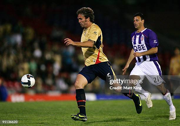 Ljubo Milicevic of the Jets controls the ball in front of Mile Sterjovski of the Glory during the round eight A-League match between the Newcastle...