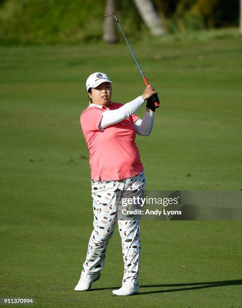 Shanshan Feng of China hits third shot on the 7th hole during the second round of the Pure Silk Bahamas LPGA Classic at the Ocean Club Golf Course on...