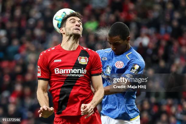 Lucas Alario of Bayer Leverkusen and Abdou Diallo of FSV Mainz 05 battle for the ball during the Bundesliga match between Bayer 04 Leverkusen and 1....