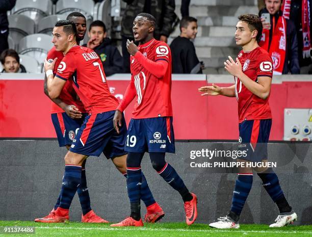 Lille's Dutch-Morrocan forward Anwar El-Ghazi is congratuled by teammates after scoring a goal during the French L1 football match between Lille and...