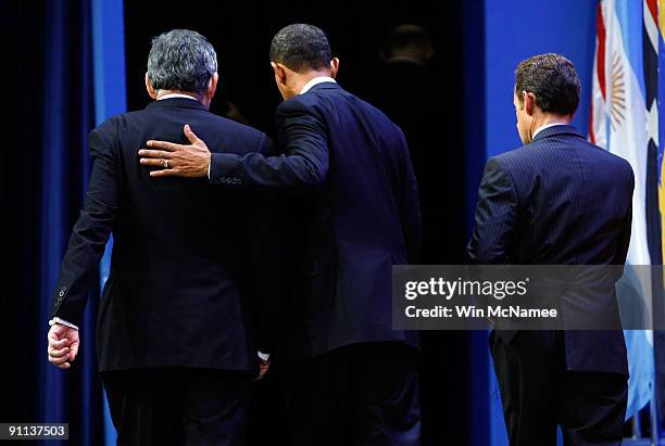 President Barack Obama puts his arm around British Prime Minister Gordon Brown while departing with French President Nikolas Sarkozy following a...