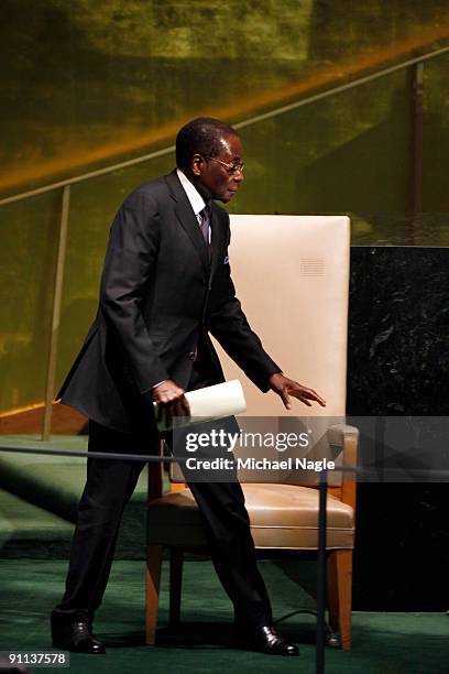 President of Zimbabwe Robert Mugabe walks to address the United Nations General Assembly at the UN headquarters on September 25, 2009 in New York...